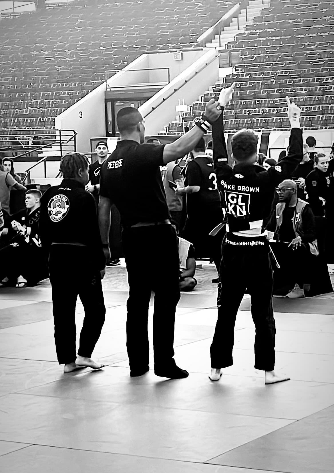 Blake Brown with hand raised in victory at competition